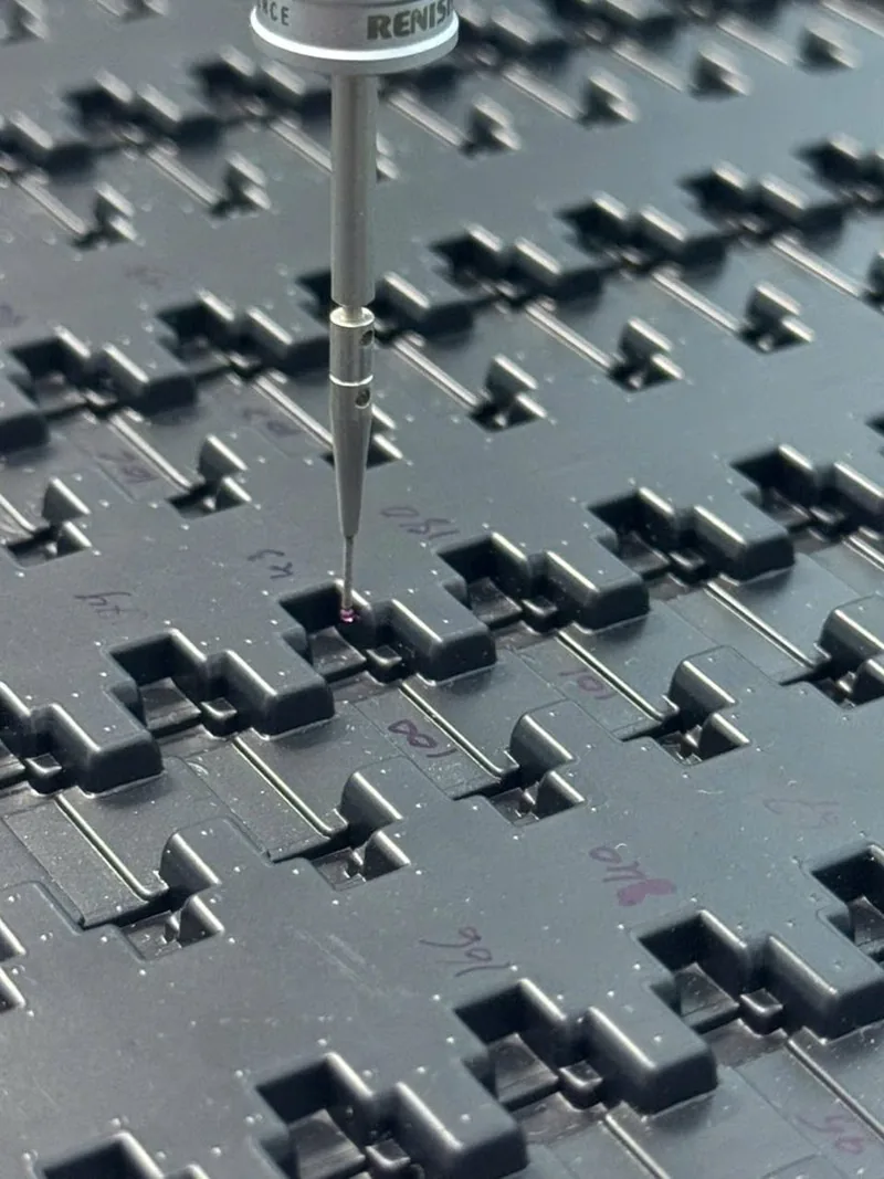 CMM probe inspecting an ESD tray